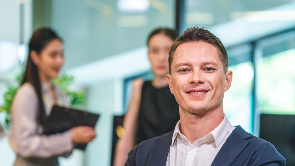 Confident business owner smiling after receiving fast bridging loan funding